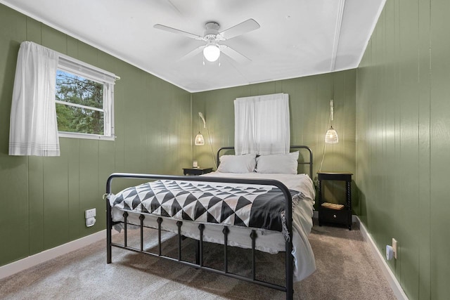 bedroom featuring carpet flooring, baseboards, and ceiling fan