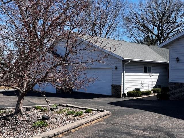 3403 Lever St Unit B, Eau Claire, WI 54701 - view of home's exterior featuring aphalt driveway and an attached garage