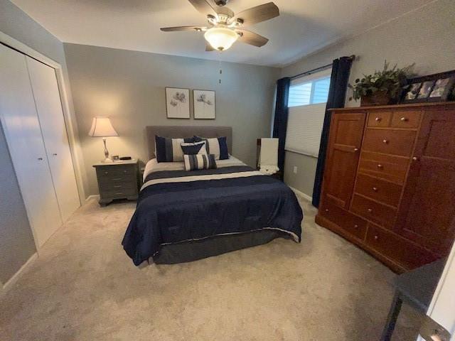 3403 Lever St Unit B, Eau Claire, WI 54701 - bedroom with baseboards, a closet, a ceiling fan, and light colored carpet