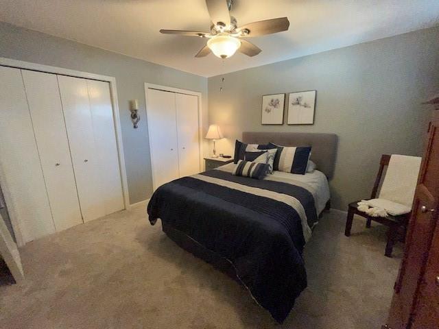 3403 Lever St Unit B, Eau Claire, WI 54701 - carpeted bedroom with ceiling fan and two closets
