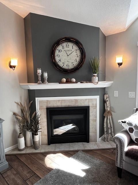 3403 Lever St Unit B, Eau Claire, WI 54701 - room details with baseboards, a fireplace, and wood finished floors