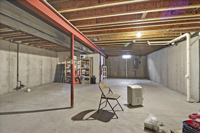 unfinished below grade area with electric panel