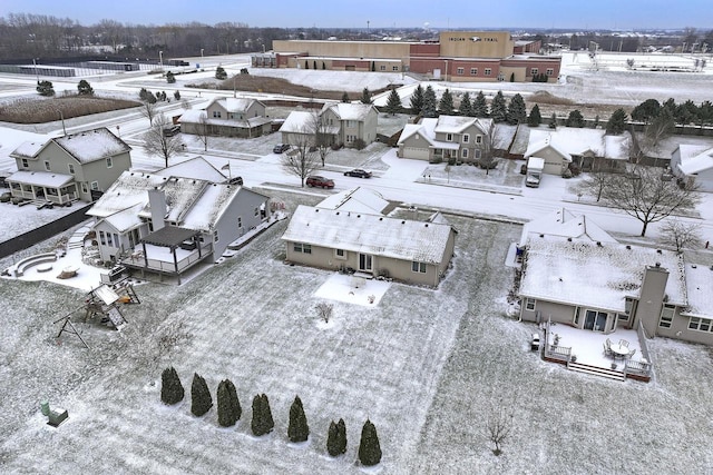 snowy aerial view featuring a residential view