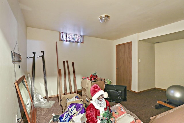 dining room featuring carpet flooring and baseboards