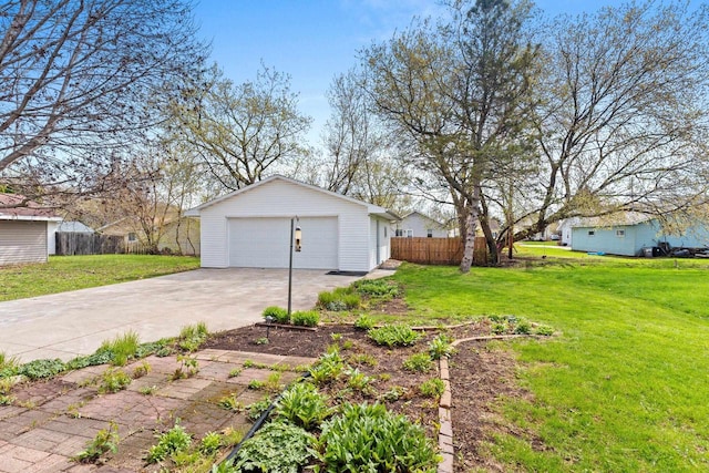view of yard with an outbuilding, fence, and a garage