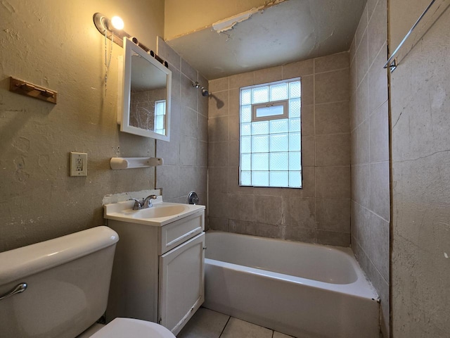 5535 N 40th St, Milwaukee, WI 53209 - full bath featuring tile patterned flooring, toilet, bathtub / shower combination, and vanity
