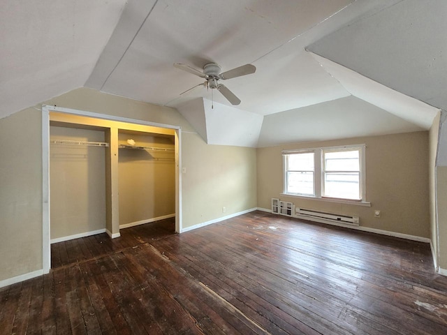 5535 N 40th St, Milwaukee, WI 53209 - unfurnished bedroom featuring a closet, baseboards, baseboard heating, lofted ceiling, and hardwood / wood-style flooring