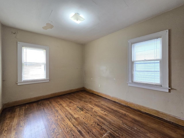 5535 N 40th St, Milwaukee, WI 53209 - spare room with wood finished floors and baseboards
