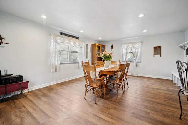 dining room featuring recessed lighting, baseboards, and wood finished floors