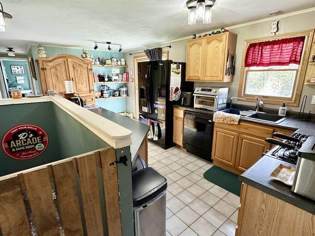 kitchen featuring a sink, light tile patterned flooring, black appliances, a toaster, and crown molding