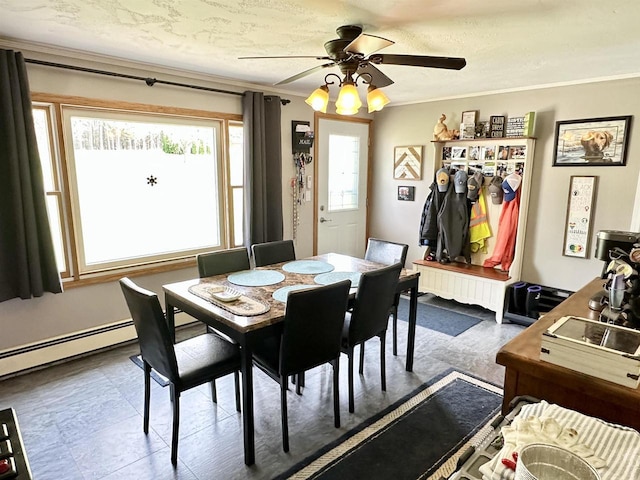 dining space with ornamental molding and ceiling fan