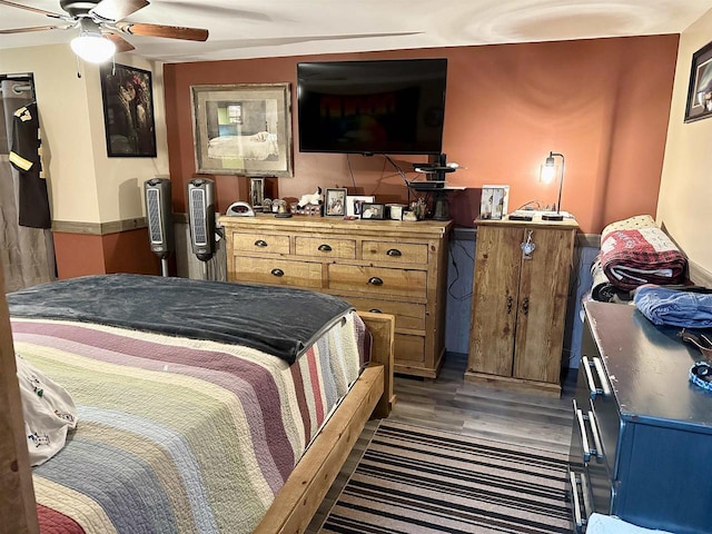bedroom with ceiling fan and wood finished floors