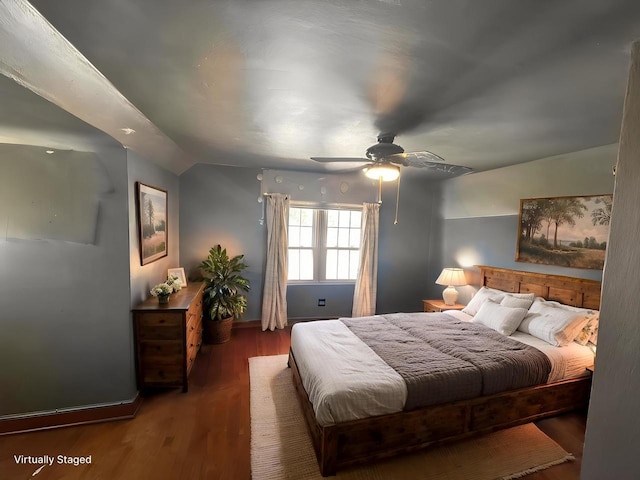 bedroom with wood finished floors, baseboards, lofted ceiling, and ceiling fan