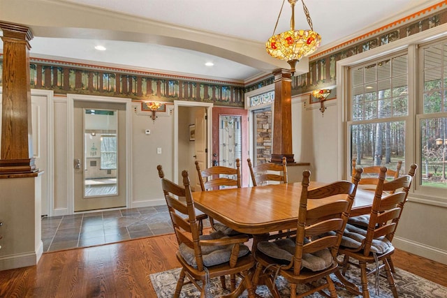 dining room with wood finished floors, baseboards, decorative columns, and recessed lighting