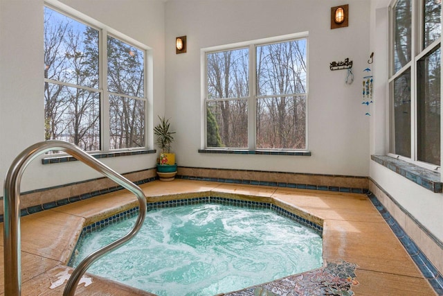 view of pool with an indoor in ground hot tub