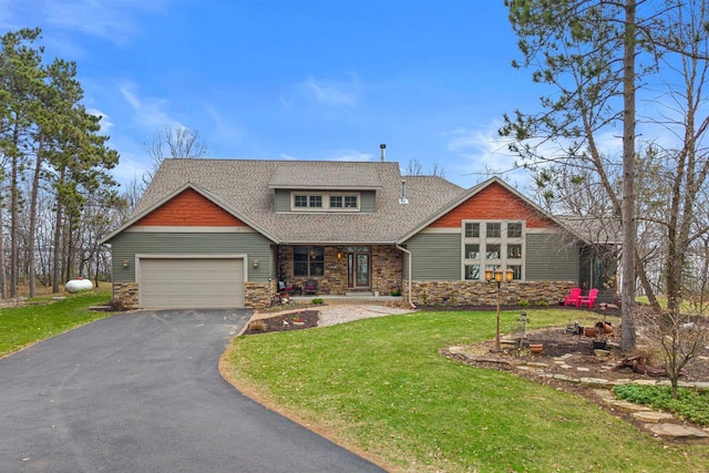 craftsman inspired home with an attached garage, stone siding, driveway, a front yard, and a shingled roof