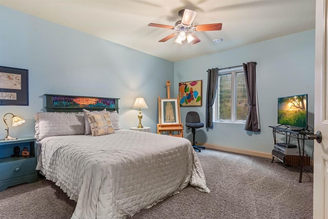 carpeted bedroom with baseboards and a ceiling fan