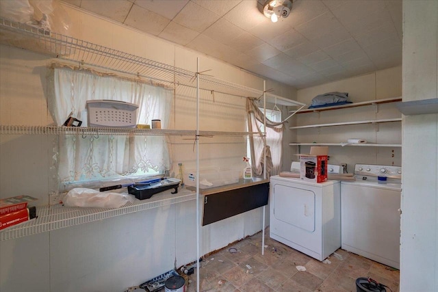 washroom with laundry area and washing machine and dryer