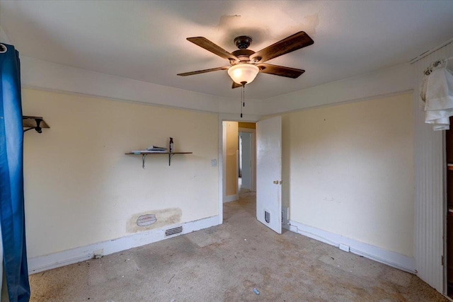 carpeted spare room with baseboards and ceiling fan