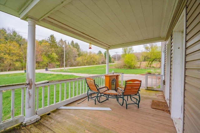 wooden deck with a yard