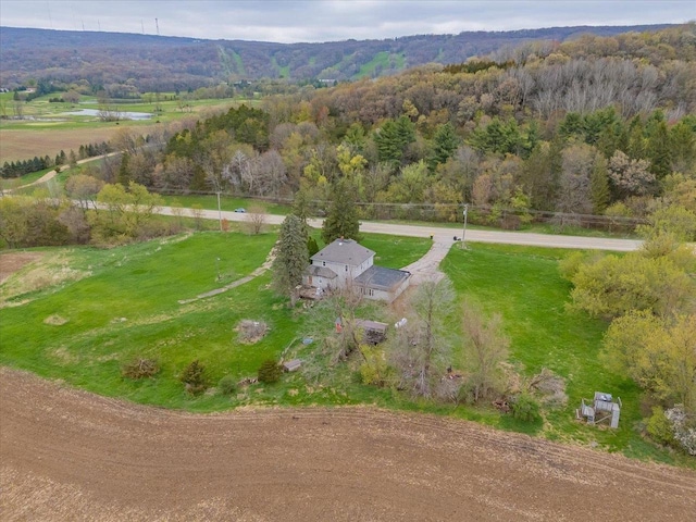 birds eye view of property featuring a rural view and a forest view