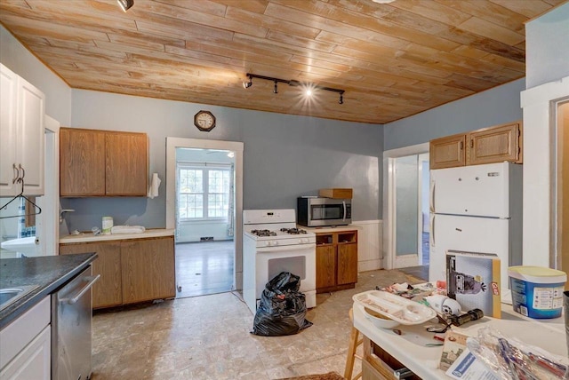 kitchen with stainless steel appliances, light floors, track lighting, wood ceiling, and dark countertops