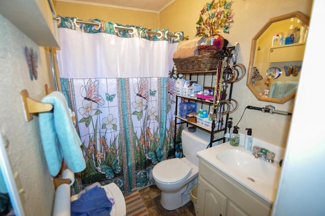 full bathroom featuring toilet, ornamental molding, vanity, and curtained shower