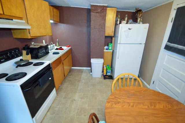 kitchen with freestanding refrigerator, electric range, under cabinet range hood, light countertops, and black microwave