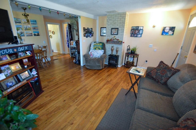 living area featuring light wood-type flooring and visible vents