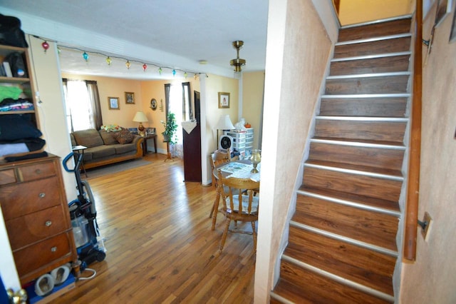 stairs with wood finished floors