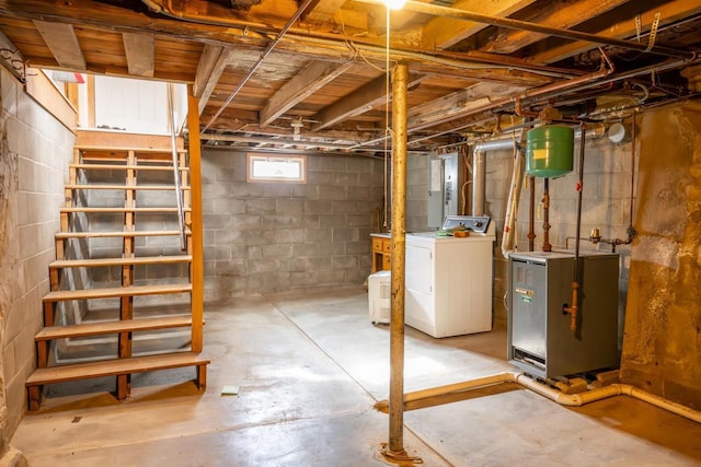 basement with washer / clothes dryer and a heating unit