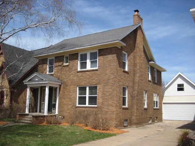 view of property exterior featuring brick siding, an outbuilding, a chimney, and a garage