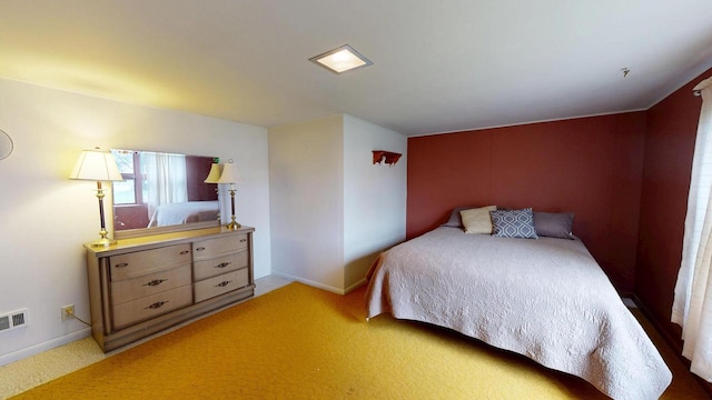 bedroom with light carpet, baseboards, and visible vents