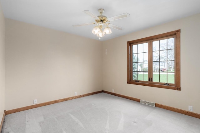 W11330 Rose Eld Rd, Ripon, WI 54971 - empty room featuring baseboards, a ceiling fan, visible vents, and light colored carpet