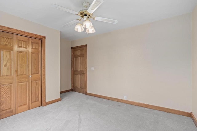 W11330 Rose Eld Rd, Ripon, WI 54971 - unfurnished bedroom with light carpet, baseboards, and a ceiling fan