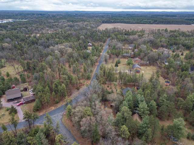birds eye view of property with a forest view