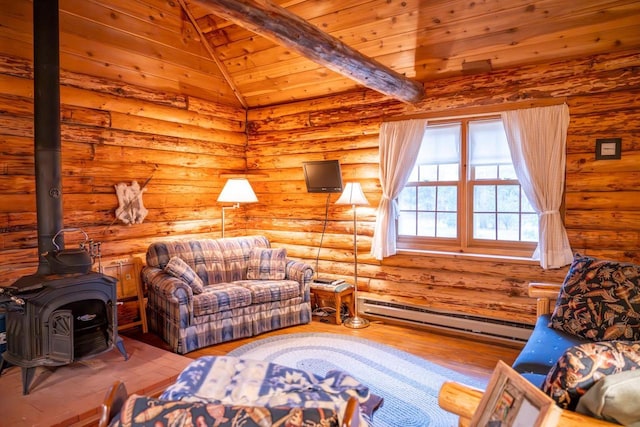 living area featuring wood finished floors, a baseboard heating unit, a wood stove, rustic walls, and lofted ceiling