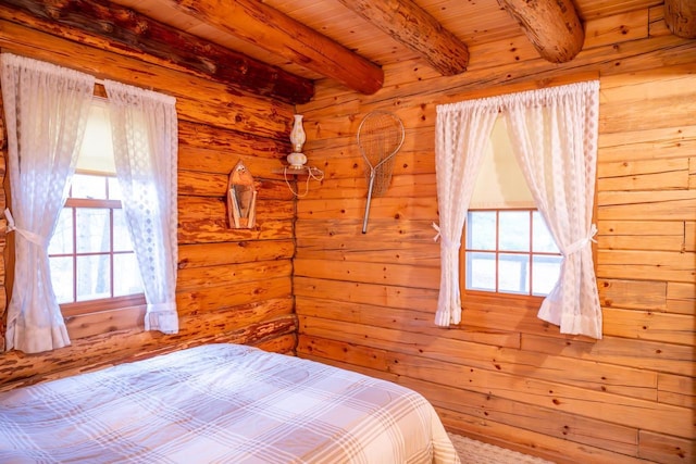 bedroom with beam ceiling, wood ceiling, and multiple windows
