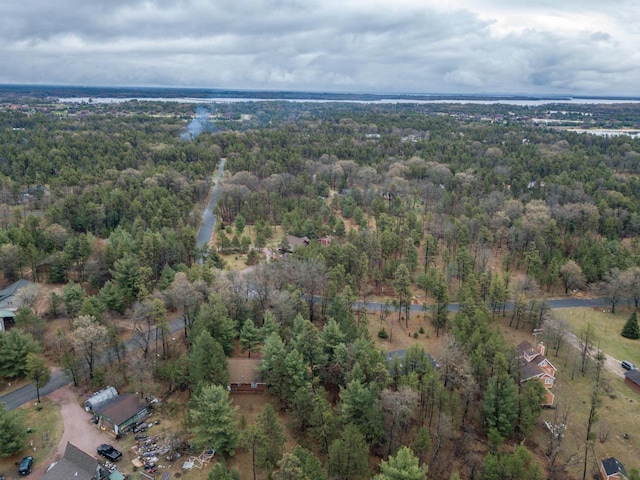 aerial view featuring a wooded view