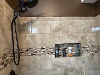 details with a tile shower
