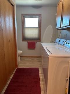 clothes washing area featuring independent washer and dryer and laundry area