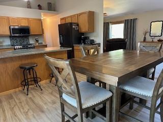 dining room with light wood-style flooring