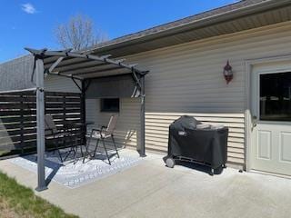 view of patio with a pergola and outdoor dining area