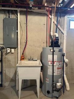 utility room with water heater and electric panel