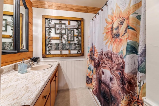 bathroom featuring vanity and curtained shower