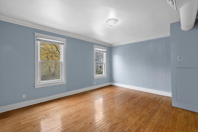 3303 W Juneau Ave Unit 3311, Milwaukee, WI 53208 - spare room featuring baseboards, a wealth of natural light, and crown molding