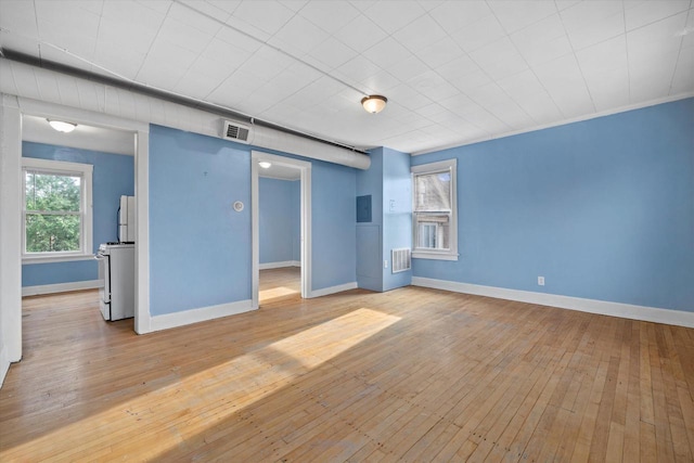 3303 W Juneau Ave Unit 3311, Milwaukee, WI 53208 - interior space featuring visible vents, baseboards, and hardwood / wood-style floors