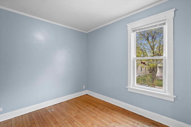 3303 W Juneau Ave Unit 3311, Milwaukee, WI 53208 - spare room with ornamental molding, wood-type flooring, baseboards, and a healthy amount of sunlight