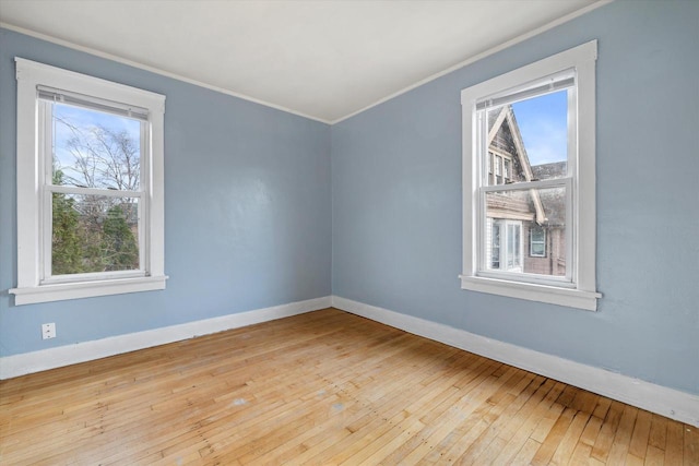 3303 W Juneau Ave Unit 3311, Milwaukee, WI 53208 - empty room with hardwood / wood-style flooring, ornamental molding, baseboards, and a healthy amount of sunlight