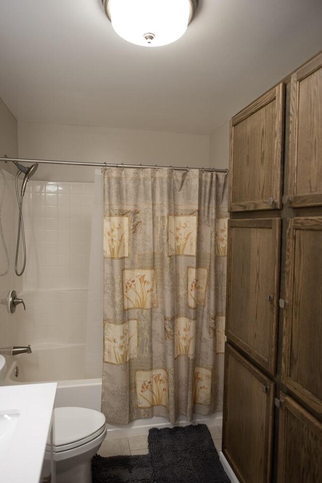 416 Gannon Ct, Tomah, WI 54660 - full bathroom with tile patterned floors, toilet, shower / tub combo with curtain, and vanity
